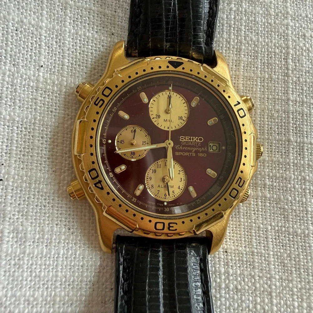 Seiko Sports 150 Chronograph Maroon Dial Gold Tone Watch 7T32-6B89 Black Leather